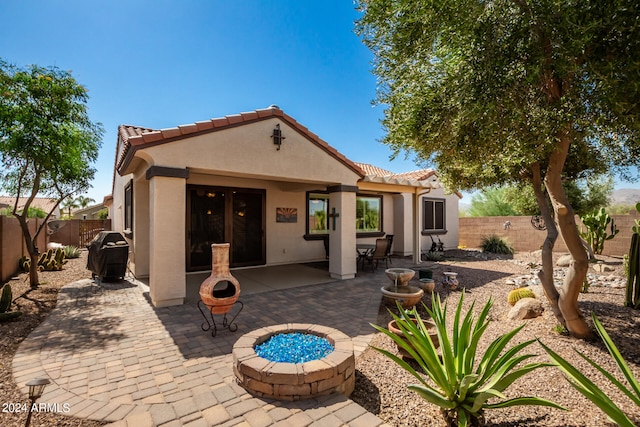 rear view of house featuring a patio