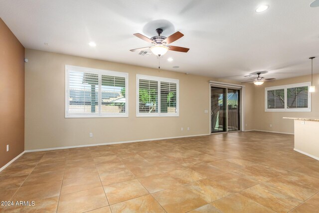 unfurnished room with baseboards, visible vents, ceiling fan, and recessed lighting