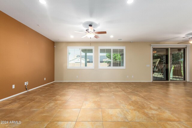 spare room featuring recessed lighting, baseboards, light tile patterned flooring, and ceiling fan