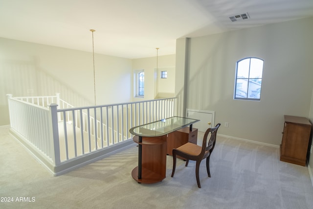 home office with light colored carpet