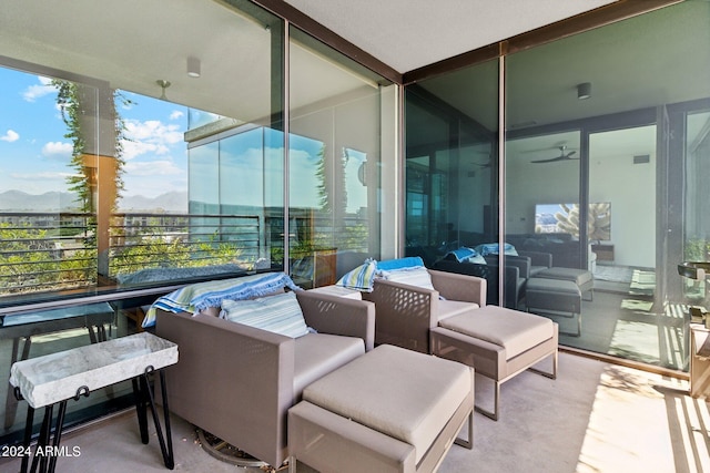 interior space with a balcony and a mountain view