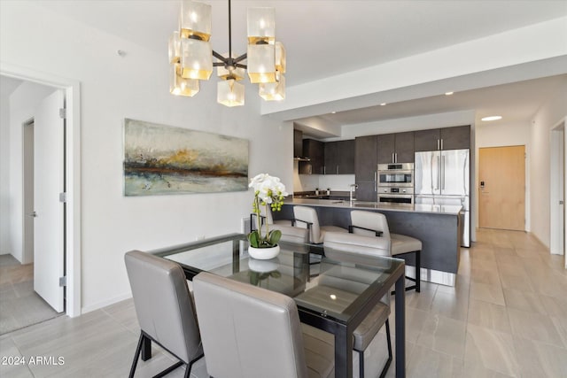 dining space with an inviting chandelier, sink, and light tile patterned flooring