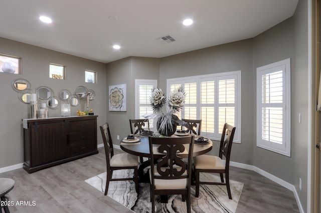 dining room with light hardwood / wood-style flooring