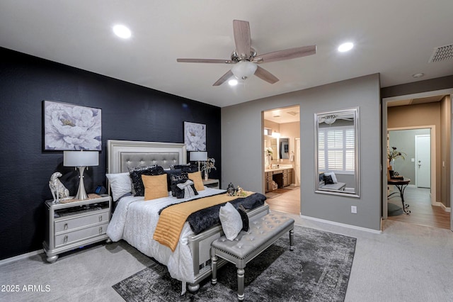 bedroom with ceiling fan, carpet, and ensuite bath