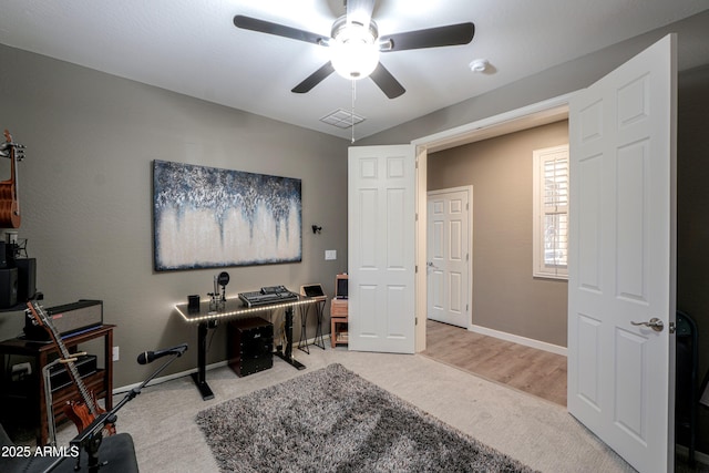 office with ceiling fan and light carpet