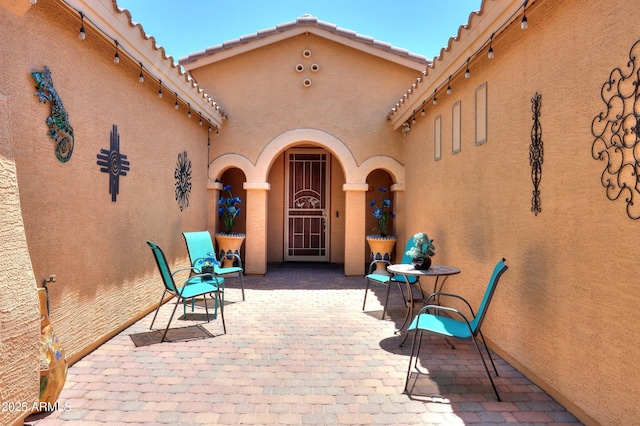 property entrance with a patio area