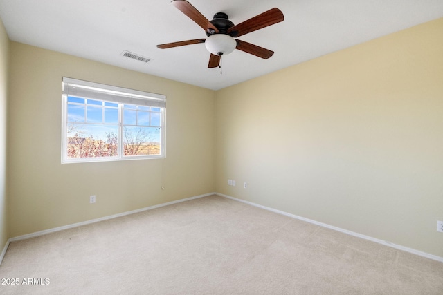 unfurnished room featuring light carpet, visible vents, ceiling fan, and baseboards