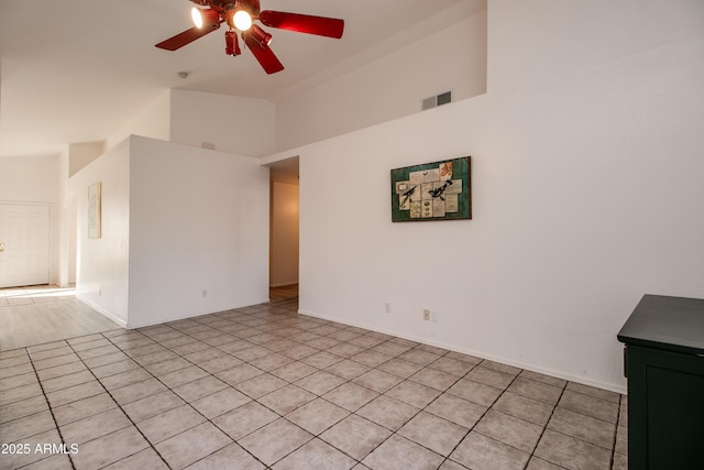 empty room with lofted ceiling and ceiling fan