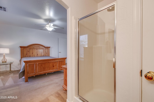 bedroom with ceiling fan and light carpet