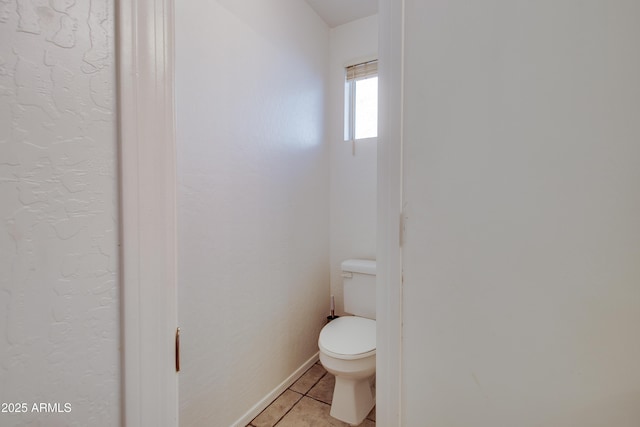 bathroom with tile patterned floors and toilet