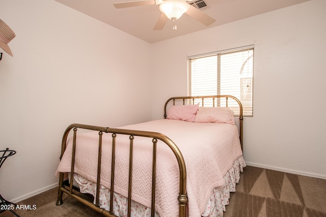 bedroom with dark colored carpet and ceiling fan