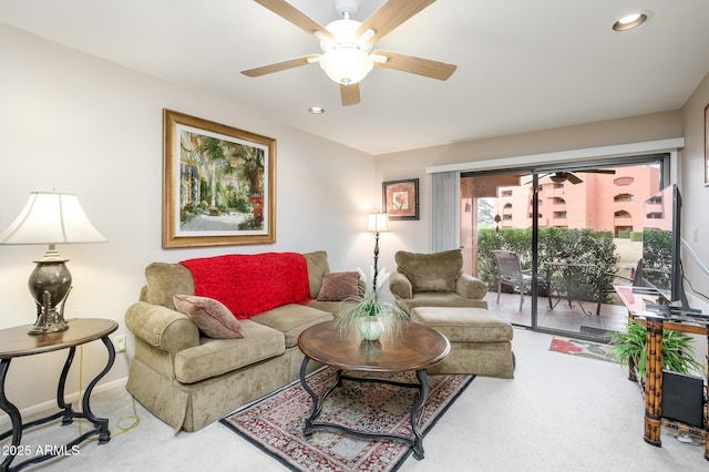 carpeted living room featuring ceiling fan