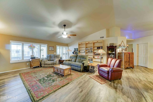 1704 S Barkley Rd, Apache Junction, AZ 85119 - living area with wood finished floors, ceiling fan, and vaulted ceiling