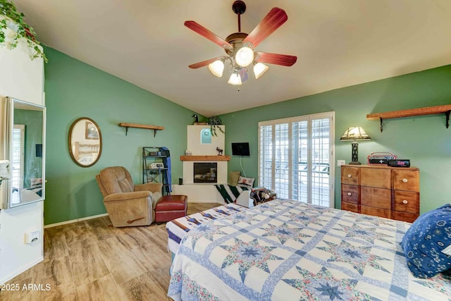 1704 S Barkley Rd, Apache Junction, AZ 85119 - bedroom with vaulted ceiling, a ceiling fan, and wood finished floors
