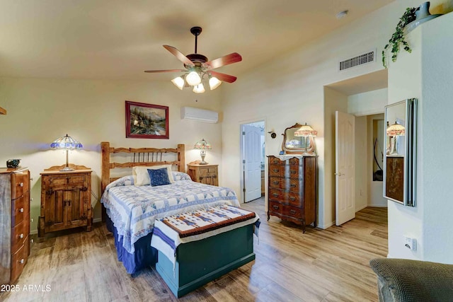 1704 S Barkley Rd, Apache Junction, AZ 85119 - bedroom featuring a wall mounted AC, wood finished floors, lofted ceiling, and ceiling fan