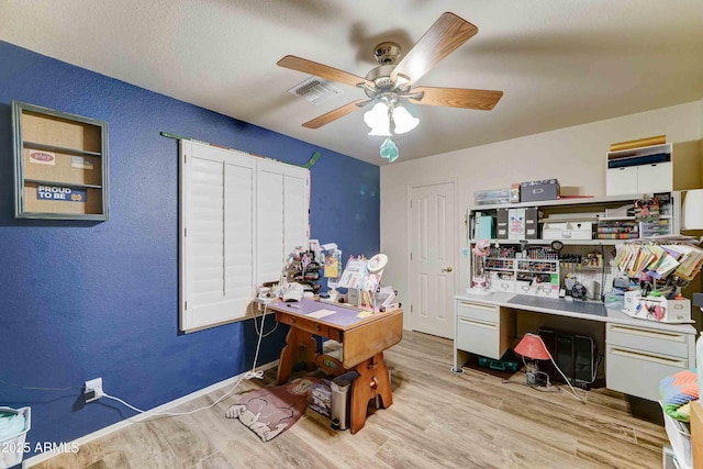 1704 S Barkley Rd, Apache Junction, AZ 85119 - office area with wood finished floors, a ceiling fan, and a textured wall