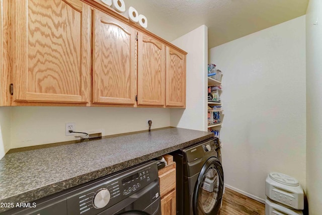 1704 S Barkley Rd, Apache Junction, AZ 85119 - laundry room with cabinet space, wood finished floors, and washing machine and clothes dryer