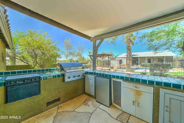 1704 S Barkley Rd, Apache Junction, AZ 85119 - view of patio featuring exterior kitchen