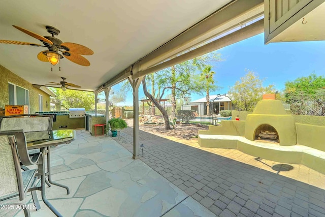 1704 S Barkley Rd, Apache Junction, AZ 85119 - view of patio / terrace with an outdoor fireplace, a ceiling fan, area for grilling, and outdoor dining space