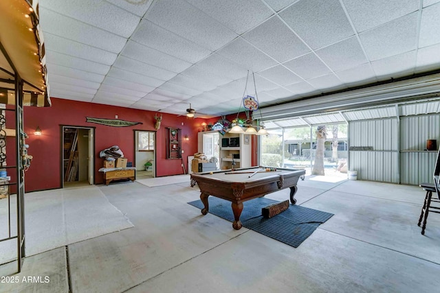 1704 S Barkley Rd, Apache Junction, AZ 85119 - rec room with concrete floors, a paneled ceiling, billiards, plenty of natural light, and a ceiling fan