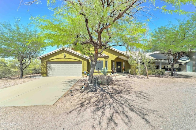 1704 S Barkley Rd, Apache Junction, AZ 85119 - ranch-style house with concrete driveway, an attached garage, and stucco siding