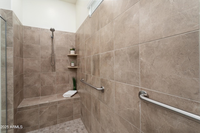 bathroom featuring a tile shower