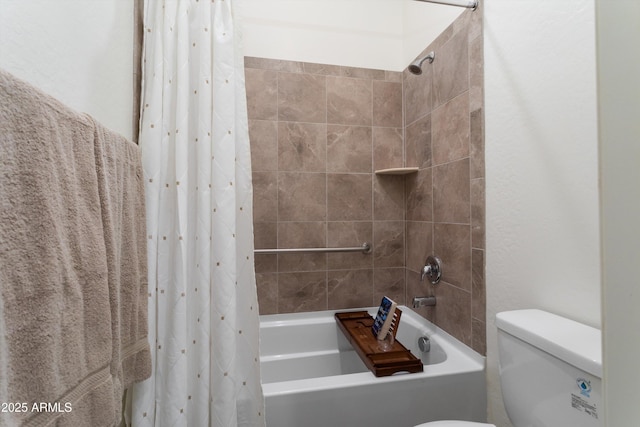 full bathroom featuring shower / bath combo with shower curtain and toilet