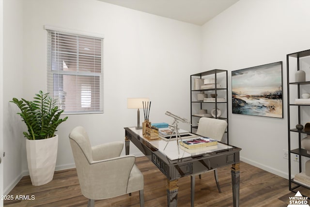 office space with wood finished floors and baseboards