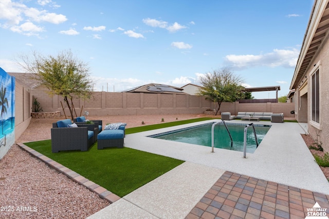 view of pool featuring an outdoor living space, a patio area, a fenced in pool, and a fenced backyard