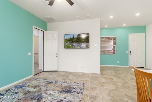 spare room with recessed lighting, ceiling fan, visible vents, and baseboards