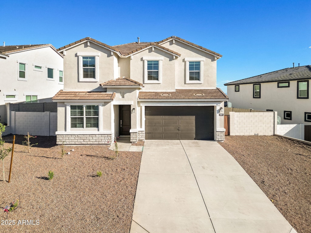 view of front of property with a garage