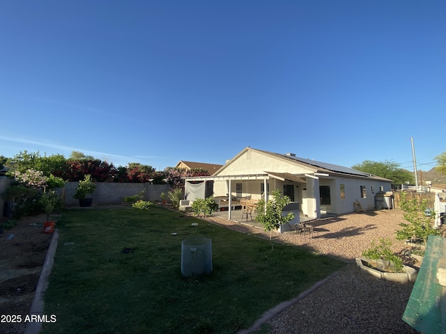 10006 N 7th Pl, Phoenix, AZ 85020 - back of property featuring solar panels, a patio area, and stucco siding