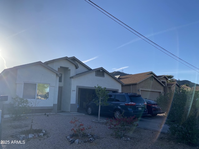 10006 N 7th Pl, Phoenix, AZ 85020 - ranch-style home featuring an attached garage, stucco siding, and concrete driveway