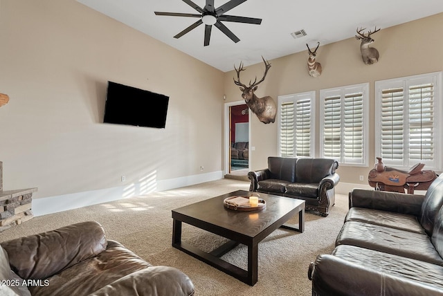 carpeted living room featuring ceiling fan and lofted ceiling