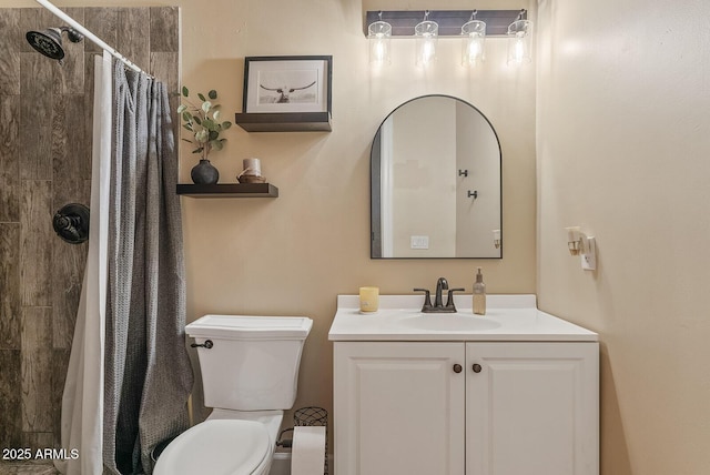 bathroom with vanity, toilet, and a shower with shower curtain