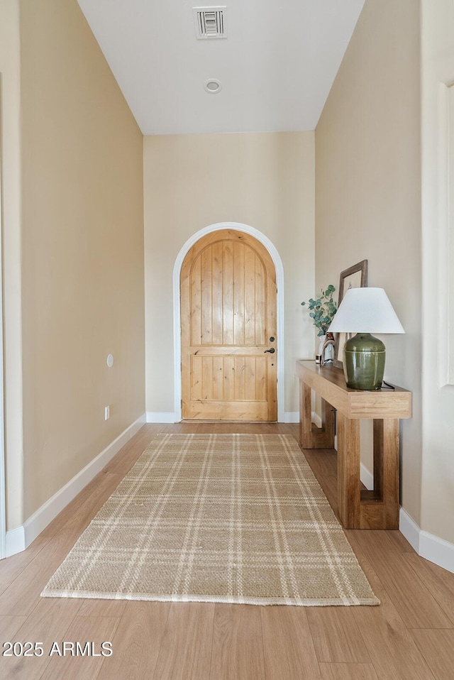 foyer entrance featuring hardwood / wood-style flooring