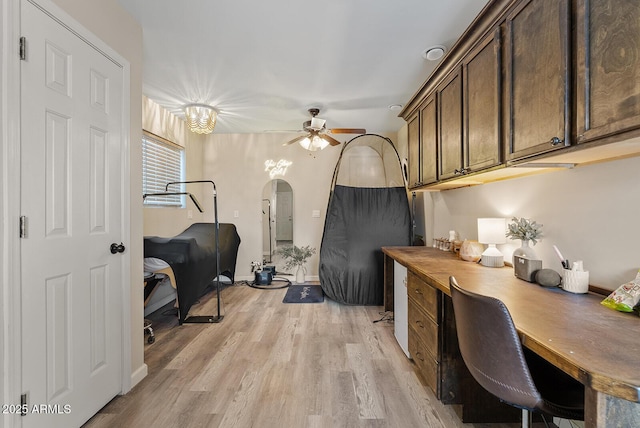 office space featuring ceiling fan and light hardwood / wood-style floors