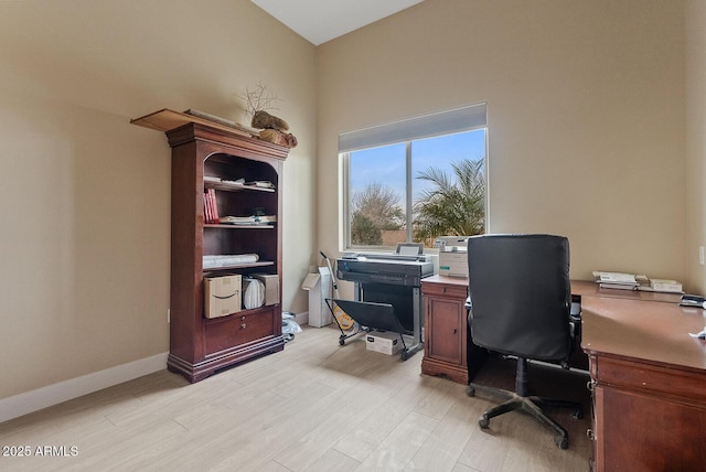 office space with light hardwood / wood-style flooring