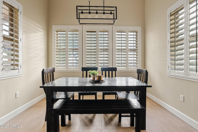 dining space with light wood-type flooring