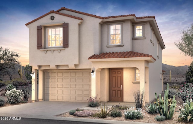 17612 W San Juan Ave, Litchfield Park, AZ 85340 - mediterranean / spanish house featuring a garage, a tile roof, driveway, and stucco siding