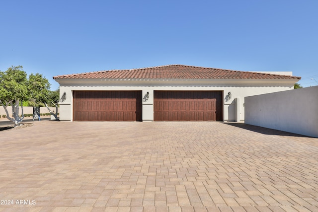 mediterranean / spanish house with a garage