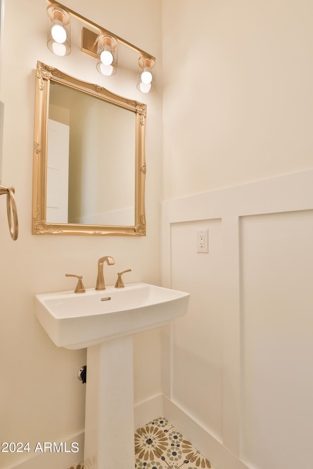 bathroom featuring sink and tile patterned flooring