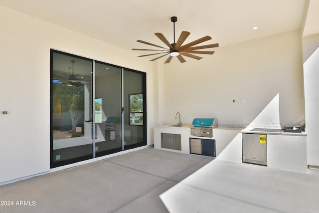 view of patio / terrace featuring sink, a grill, area for grilling, and ceiling fan