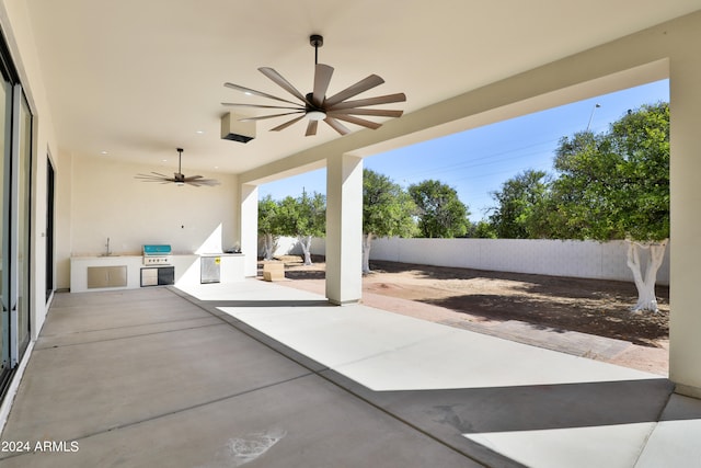 view of patio / terrace with area for grilling and ceiling fan