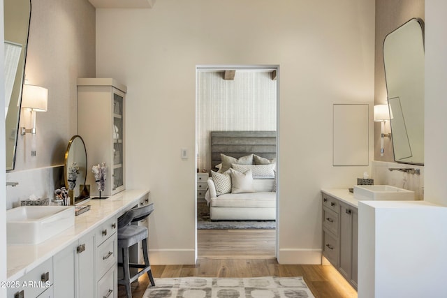 bathroom featuring vanity and wood-type flooring