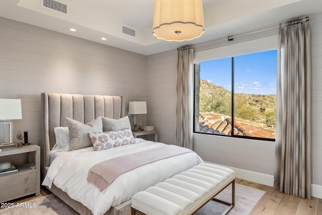 bedroom with light hardwood / wood-style flooring