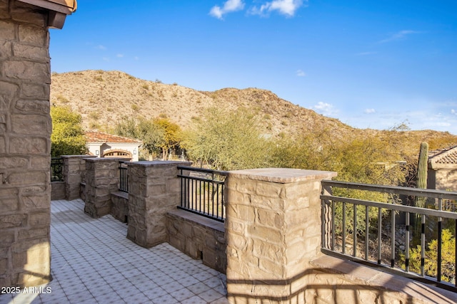 view of patio / terrace featuring a mountain view