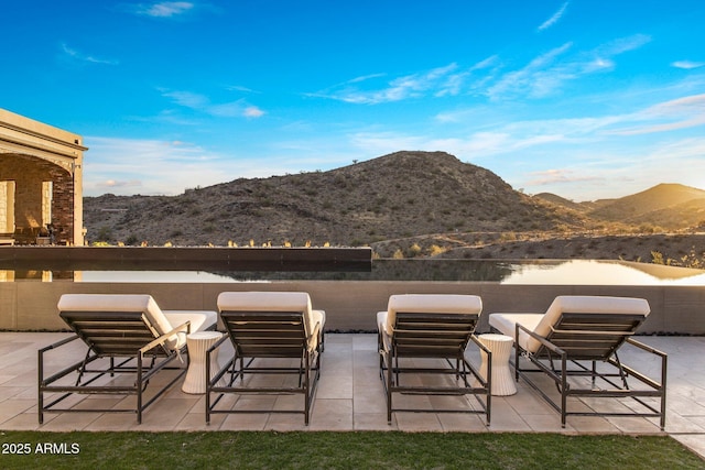 view of patio / terrace with a mountain view