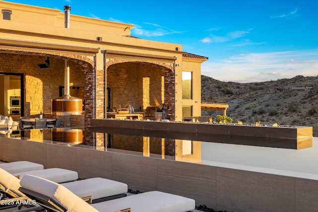 view of patio / terrace with a mountain view