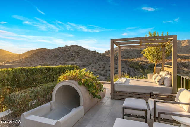 view of patio with a mountain view, a pergola, and a jacuzzi